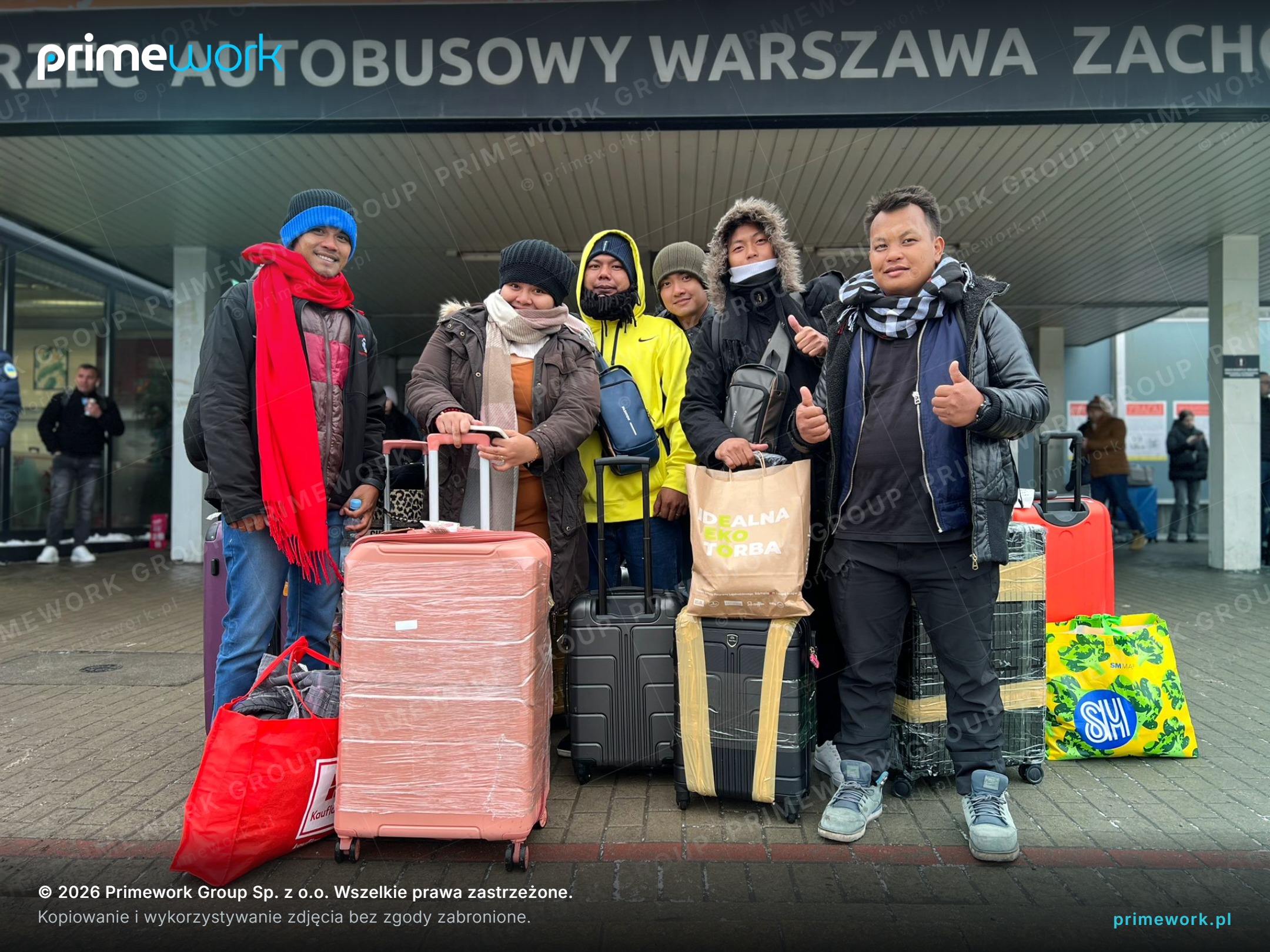 Filipino workers with suitcases in front of Warszawa Zachodnia bus station