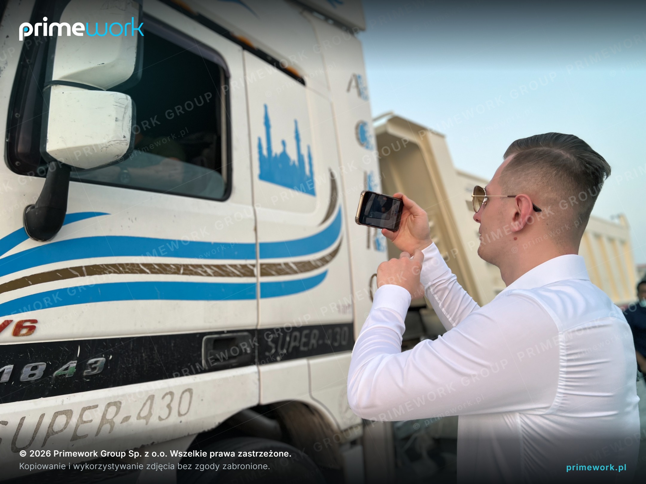 A Primework recruiter documenting a tractor unit at a transport base before handover to an Asian driver