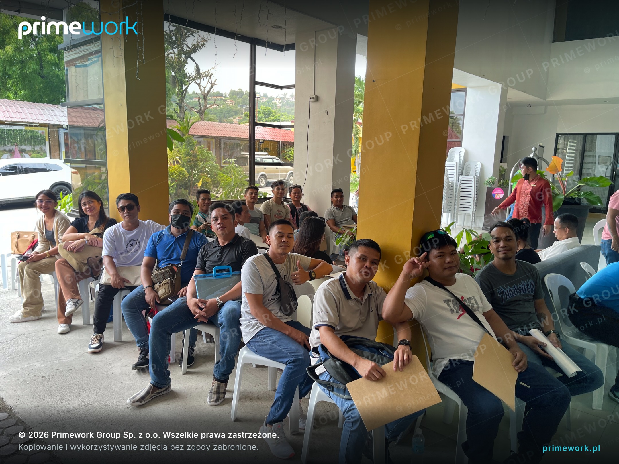 A group of candidates with documents waiting for recruitment interviews